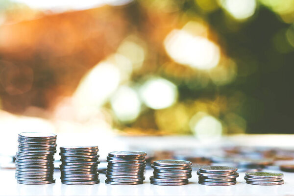 Coins stacked on borrowed background and copy space - Economy Concept - Financial and Business Freedom.