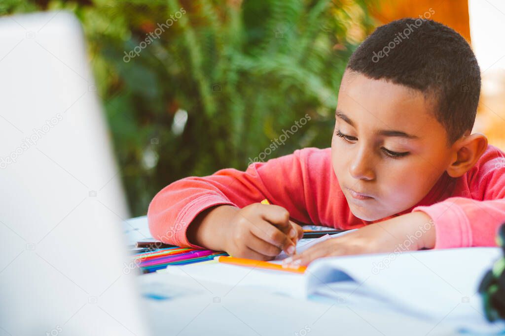 Child doing school lesson at home