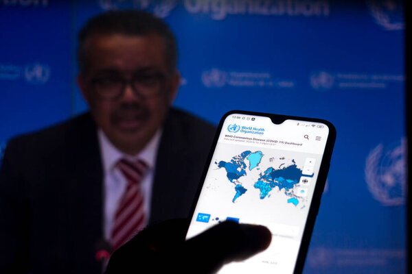 June 10, 2020, Brazil. In this photo illustration the World Health Organization (WHO) Director General Tedros Adhanom Ghebreyesus is seen on a screen of pc and a WHO coronavirus cases map displayed.