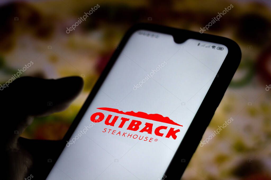 July 7, 2020, Brazil. In this photo illustration the Outback Steakhouse logo seen displayed on a smartphone