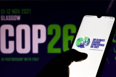 July 19, 2020, Brazil. In this photo illustration the 2021 United Nations Climate Change Conference (COP26) logo seen displayed on a smartphone clipart