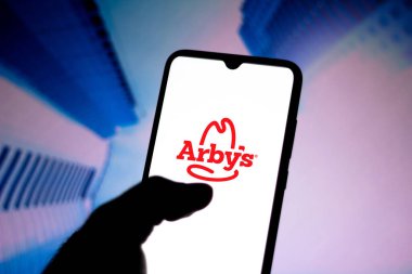 August 1, 2020, Brazil. In this photo illustration the Arbys logo seen displayed on a smartphone clipart