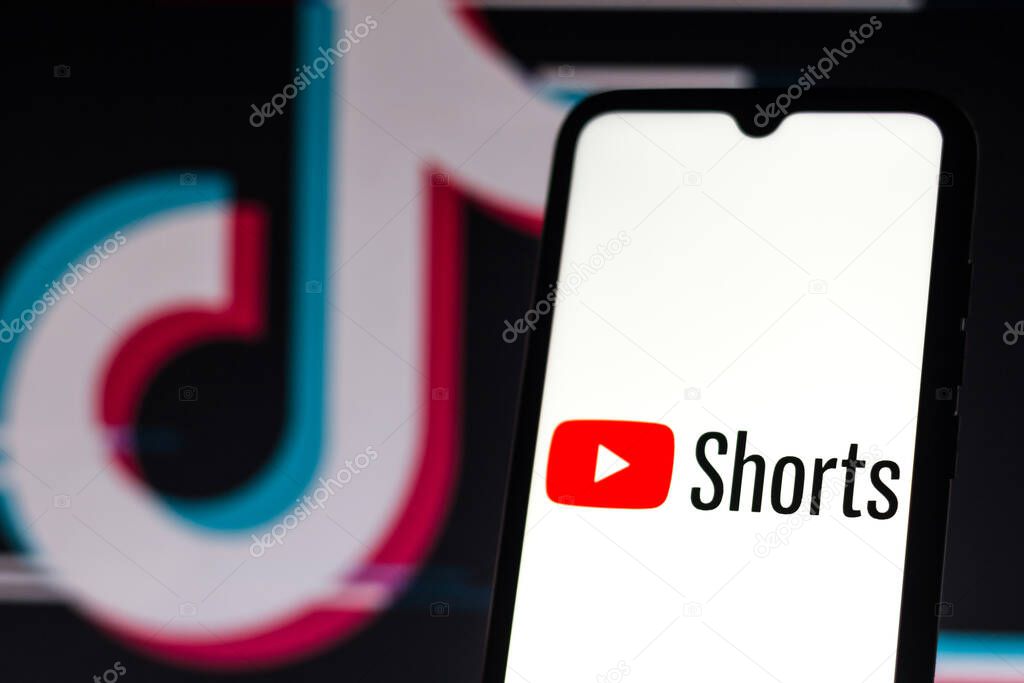 September 21, 2020, Brazil. In this photo illustration a YouTube Shorts logo is seen displayed on a smartphone with an TikTok logo on the background