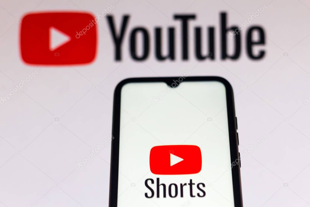 September 21, 2020, Brazil. In this photo illustration a YouTube Shorts logo is seen displayed on a smartphone with an YouTube logo on the background
