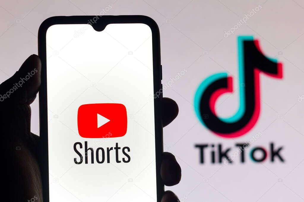 September 21, 2020, Brazil. In this photo illustration a YouTube Shorts logo is seen displayed on a smartphone with an TikTok logo on the background