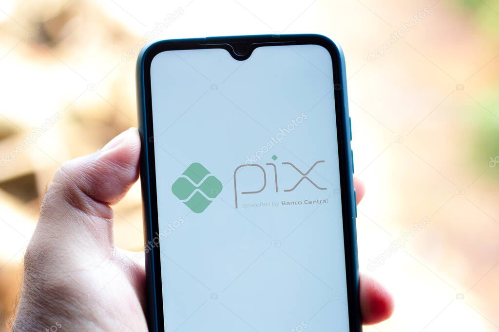 October 1, 2020, Brazil. In this photo illustration the Pix powered by Banco Central logo seen displayed on a smartphone. It is an electronic payment system in Brazil