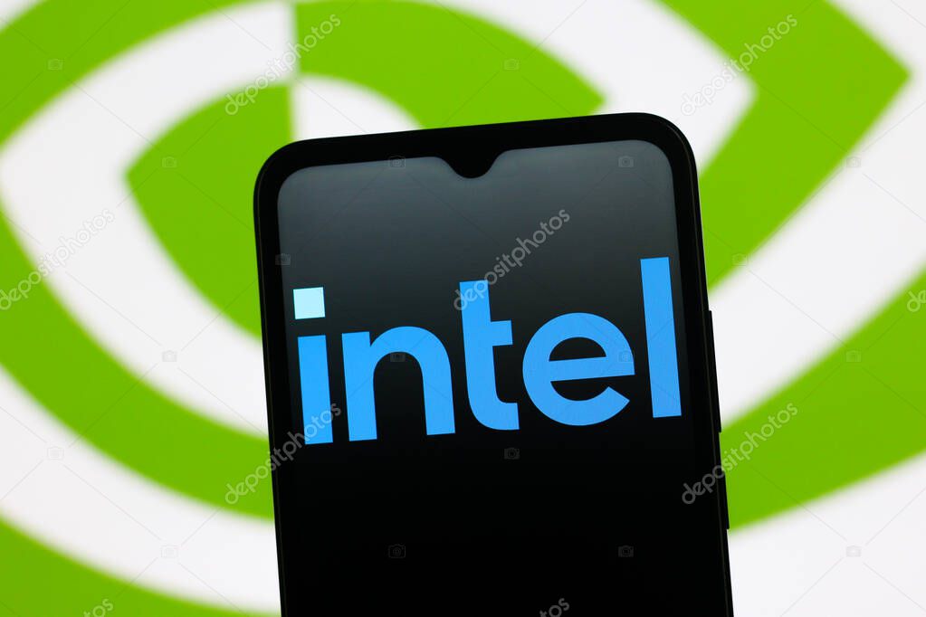 In this photo illustration, the Intel logo is seen displayed on a smartphone screen and the Nvidia logo in the background