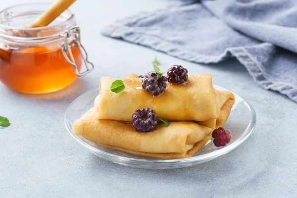 Ricotta and honey crepes served with blackberries and mint for dessert.