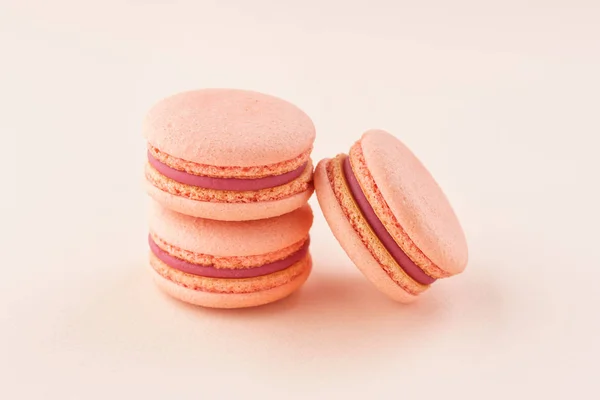 Stack of pink macarons on same color background. — Stock Photo, Image