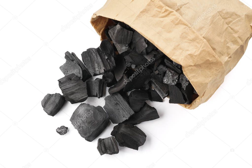Charcoal in a paper bag for igniting fire in a grill.
