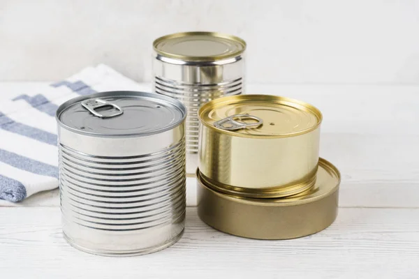 Various closed tin cans with food preserves. — Stock Photo, Image