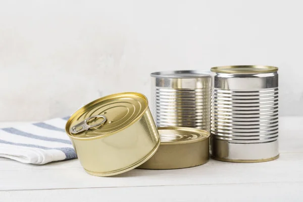 Various closed tin cans with food preserves. — Stock Photo, Image