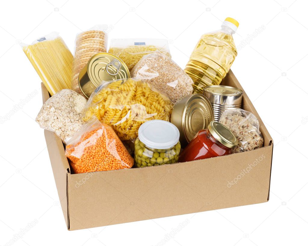 Open cardboard box with oil, canned food, cereals and pasta.