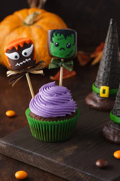 Halloween treats - cupcake and chocolate marshmallow monsters.
