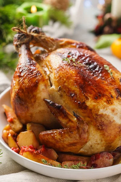 Traditional Christmas whole chicken or turkey with apples.