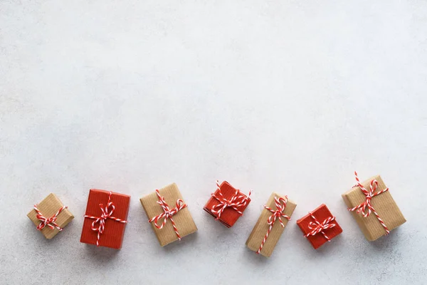 Wrapped gift boxes on light gray background. Seasonal sale. — ストック写真