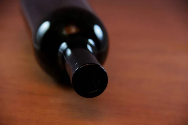 empty wine bottle on wooden table