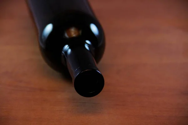 empty wine bottle on wooden table