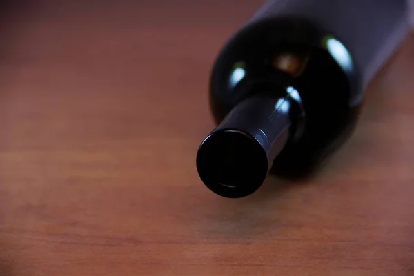 empty wine bottle on wooden table