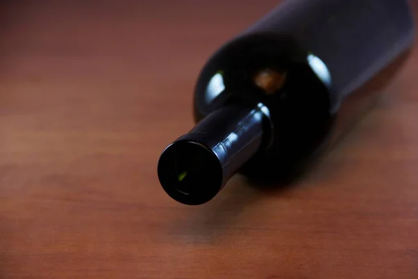 empty wine bottle on wooden table