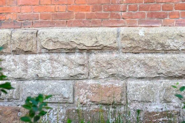 Old stone wall and stone Foundation of the house