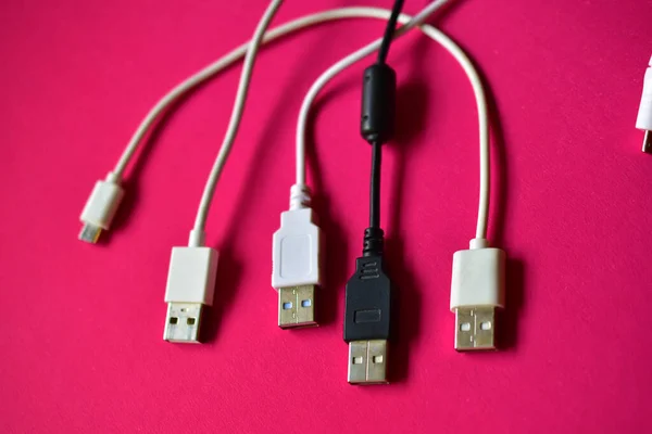 Black and white USB connectors on a red background