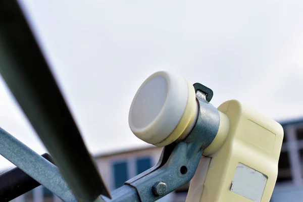 White satellite dish with receiver and transmitter