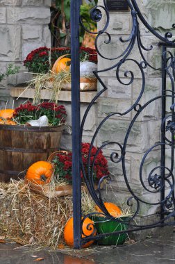 House decorated with pumpkins and fall leaves for Thanksgiving day and Halloween, New England. USA clipart