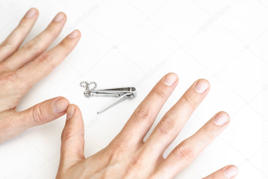 Trimmed nails of a young man. Closeup.
