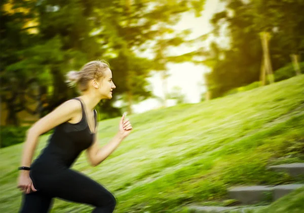 The girl runs up the stairs. Healthy lifestyle. Royalty Free Stock Images