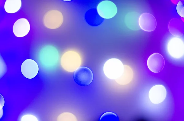 Multi-colored bokeh in neon colors. Good New Year spirit. — Stock Photo, Image