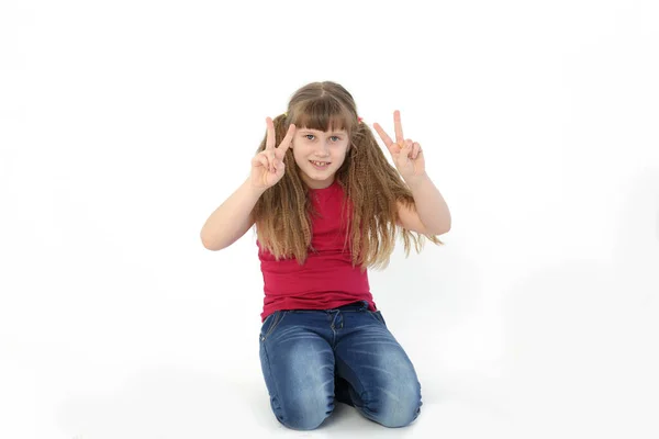 Sweet Smiling Girl Shows Number Two Her Fingers Palm — стоковое фото