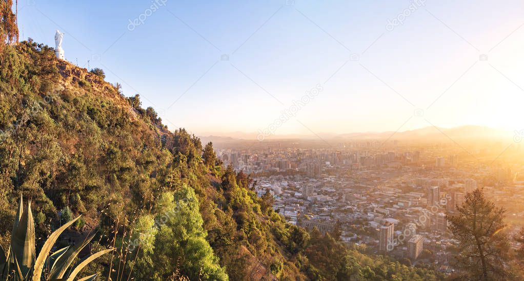 Cerro San Cristobal Hill with virgin statue and aerial view of Santiago during sunset - Santiago, Chile