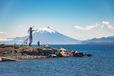 Puerto Varas, Chile - Feb 22, 2018: Licarayen Princess and Osorno Volcano - Puerto Varas, Chile clipart