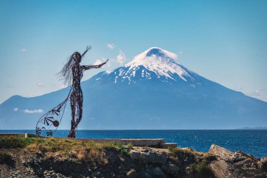 Puerto Varas, Chile - Feb 22, 2018: Licarayen Princess and Osorno Volcano - Puerto Varas, Chile clipart
