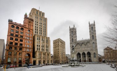 Basilica of Notre-Dame of Montreal and Place d'Armes on snow - M