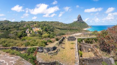 Panoramic aerial view of Fernando de Noronha and Nossa Senhora dos Remedios Fortress with Morro do Pico on background - Fernando de Noronha, Pernambuco, Brazil