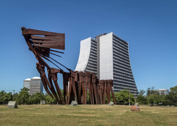 Porto Alegre, Rio Grande do Sul, Brazil - Jan 19, 2018: Azoreans (Acorianos) Monument and  Rio Grande do Sul Adminitrative Building or Centro Administrativo Fernando Ferrari (CAFF)