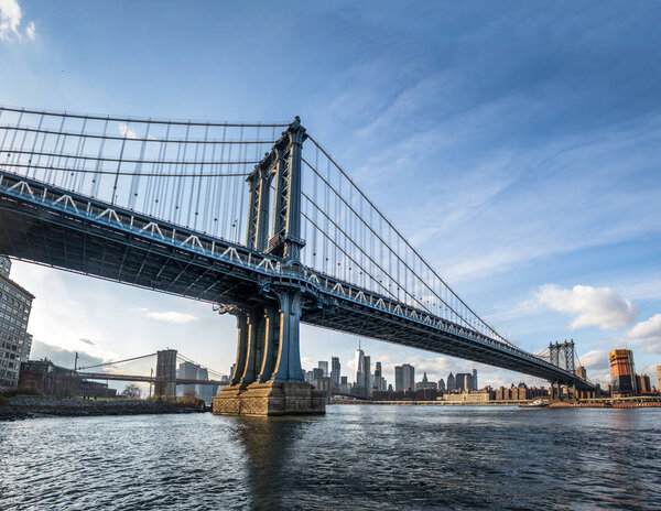 Manhattan Bridge with Brooklyn Bridge and Manhattan Skyline as b