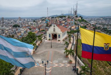 Santa Ana Church on top of Santa Ana hill with Ecuador and city flags - Guayaquil, Ecuador clipart