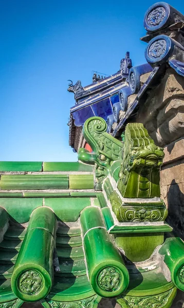 Green and blue dragon old chinese roof details
