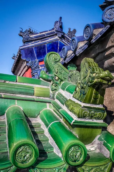 Green and blue dragon old chinese roof details