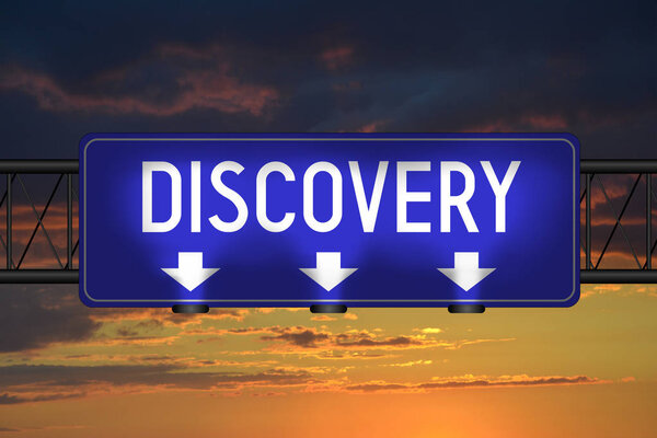 Discovery street sign, sunset sky in background.