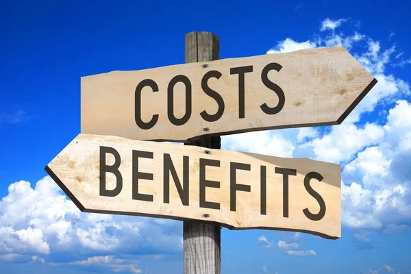 Costs, benefits - wooden signpost