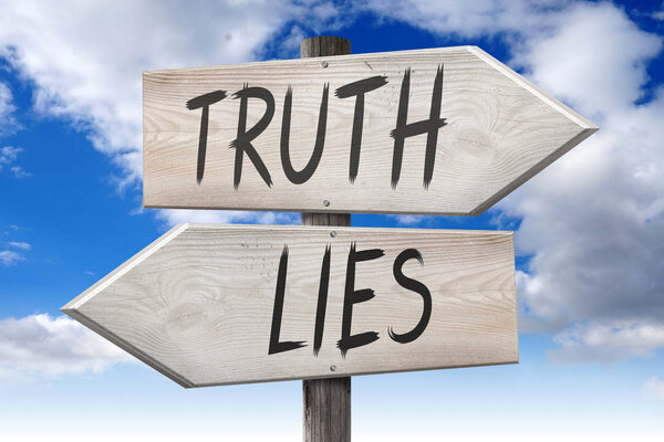 Lies, truth - wooden signpost