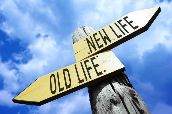 Old life, new life - wooden signpost