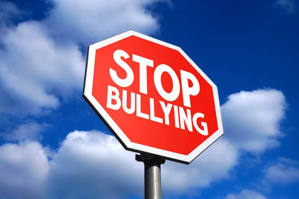 Stop bullying sign, sky in background.