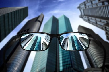 Glasses, vision concept, skyscrapers clipart