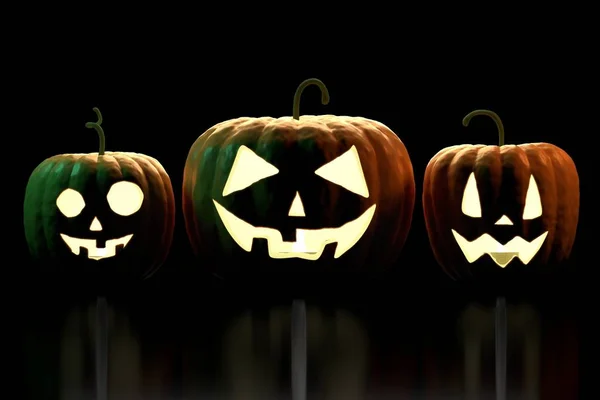 3D three Halloween pumpkins - Jack-o-Lanterns on black backgroun