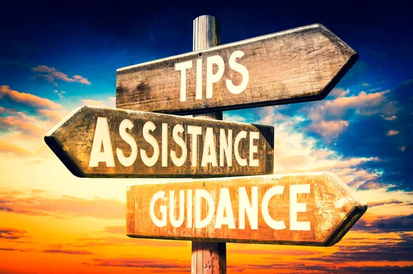 Tips, assistance, guidance - wooden signpost, roadsign with three arrows